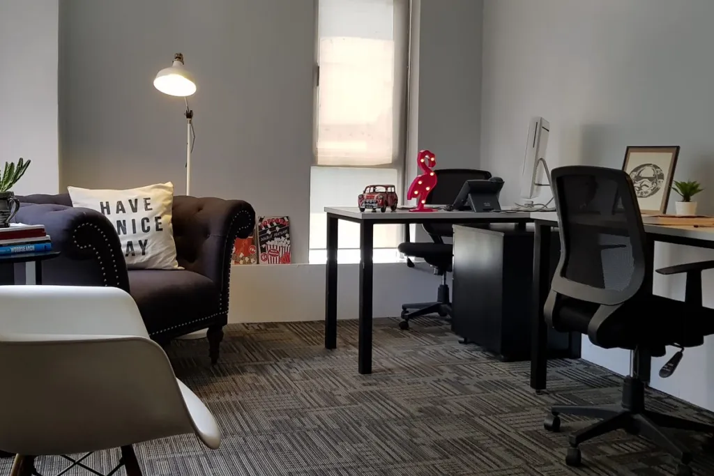 A fitted private office at Acceler8 Salcedo with desks, an armchair and storage