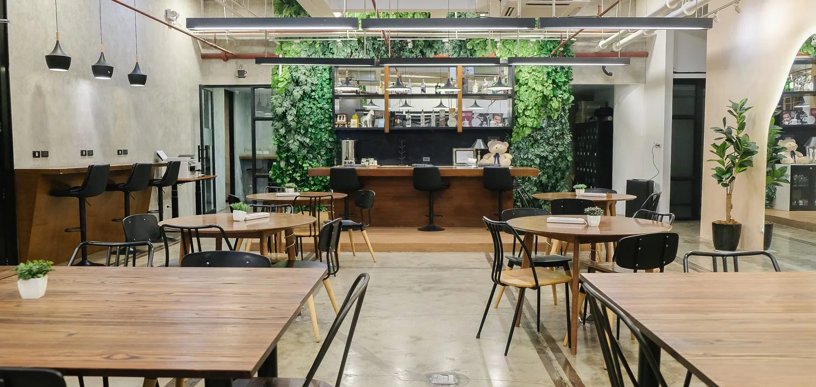 The Acceler8 open lounge with members working at long communal tables