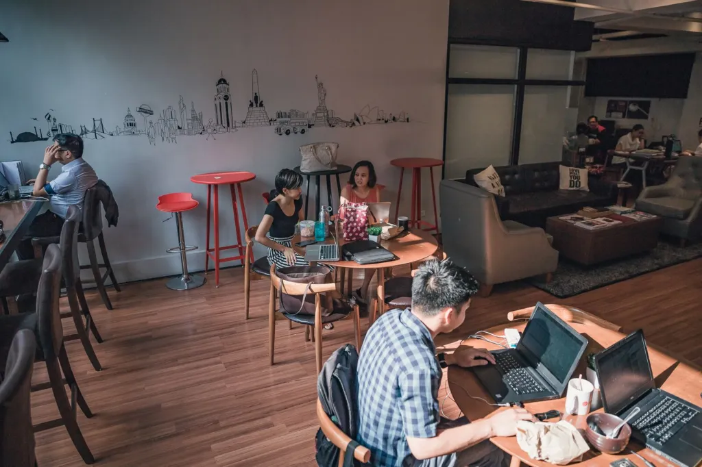 Members working on laptops in the Acceler8 Salcedo coworking lounge